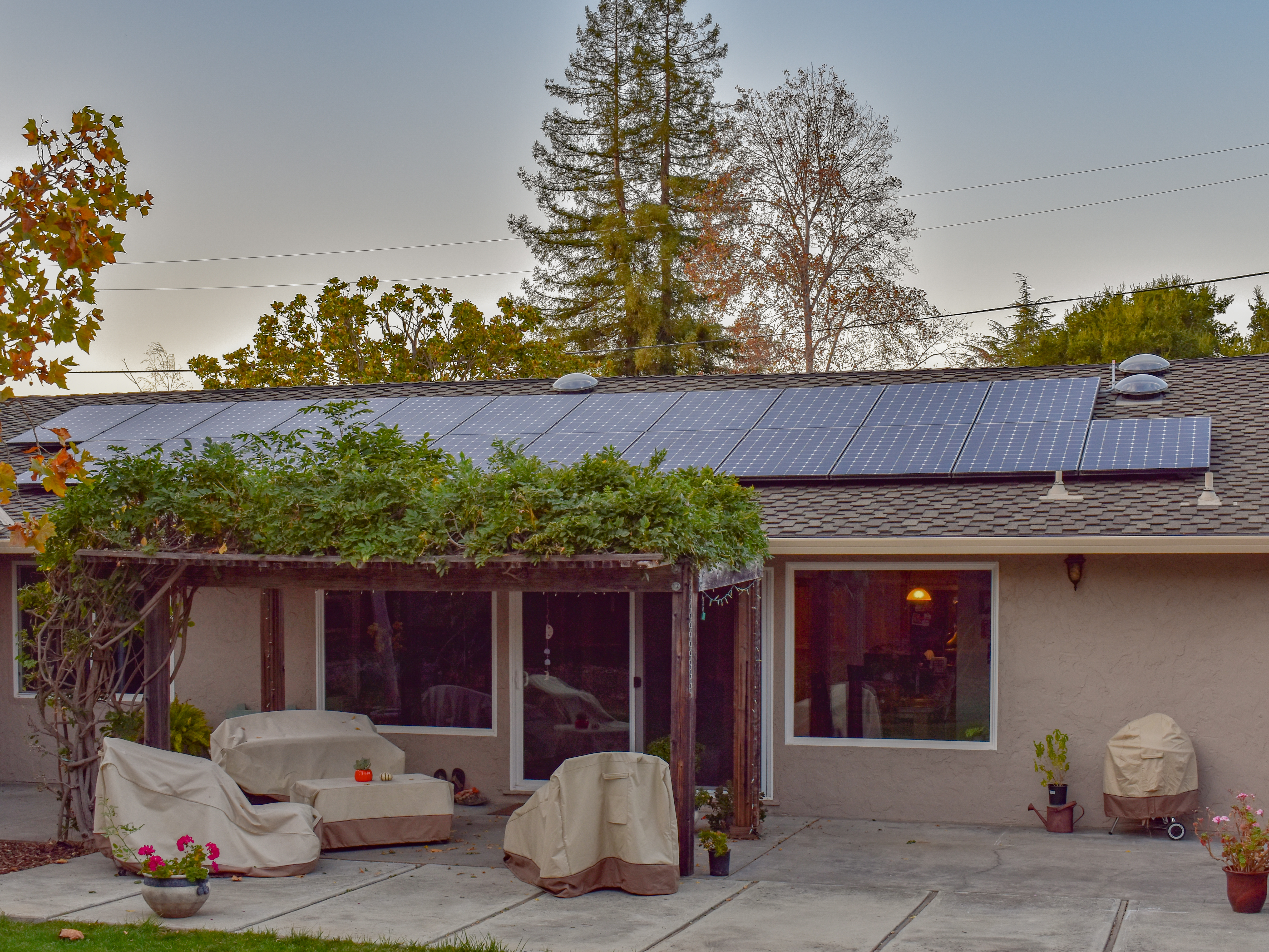 outside of a home with solar panels on the roof