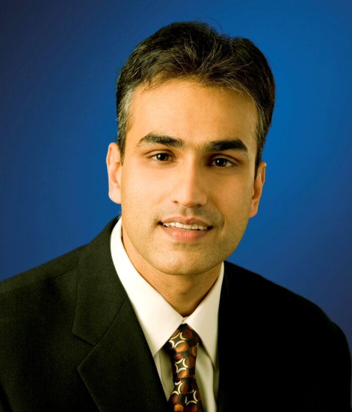 headshot of Amrit Singh