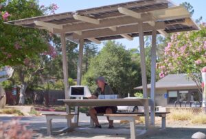 A Los Altos Hills resident using the interactive kiosk